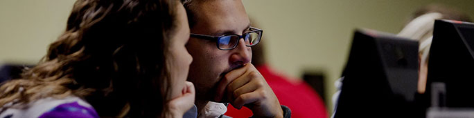 Students looking to a computer screen