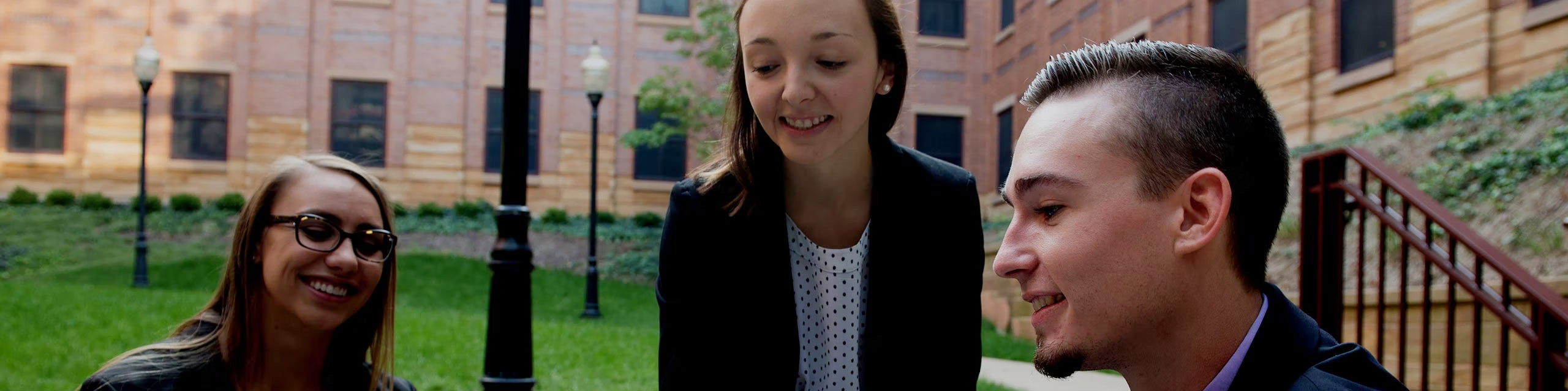 Students talking outside of the State Farm Hall of Business Building