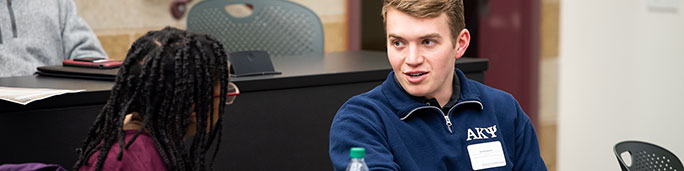 Students talking in a classroom