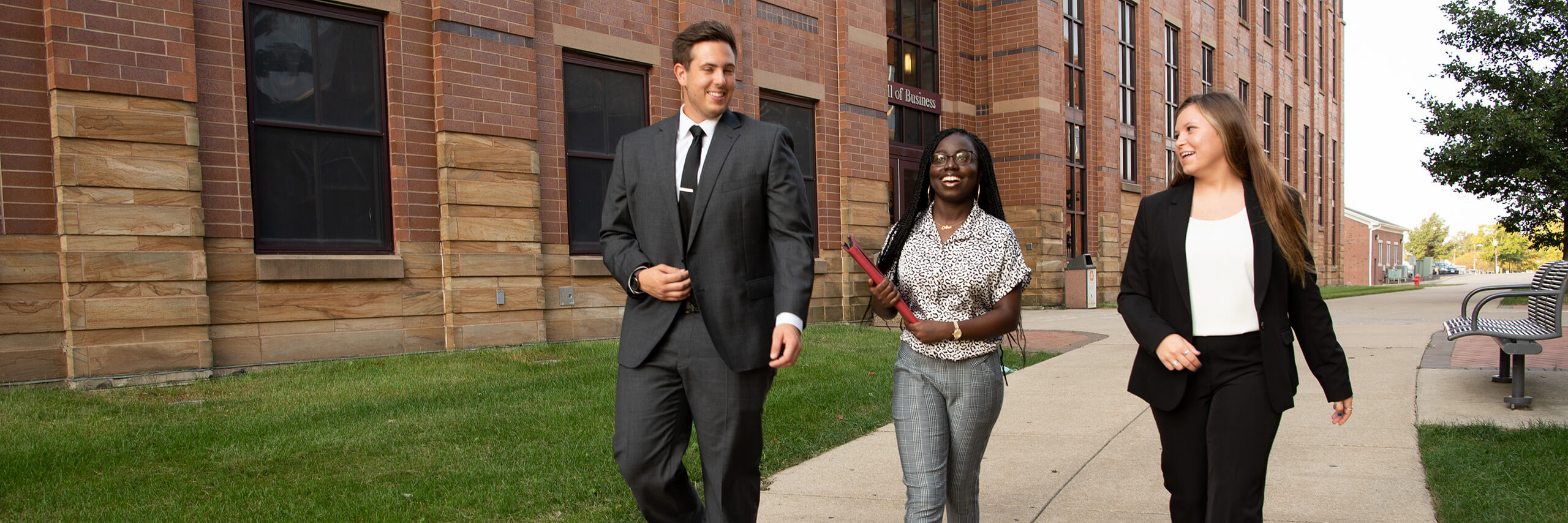 Students walking in front of College of Business building